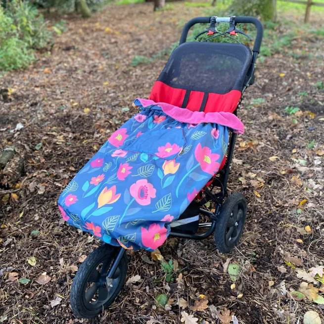 Image of wheelchiar with Bundlebean wheelchair cosy in floral print