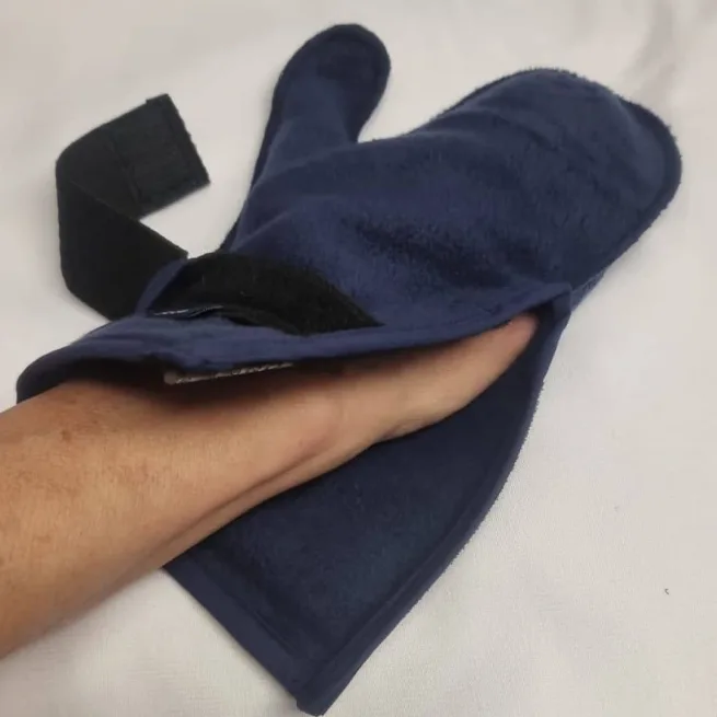 Hand inside navy fleece mitten