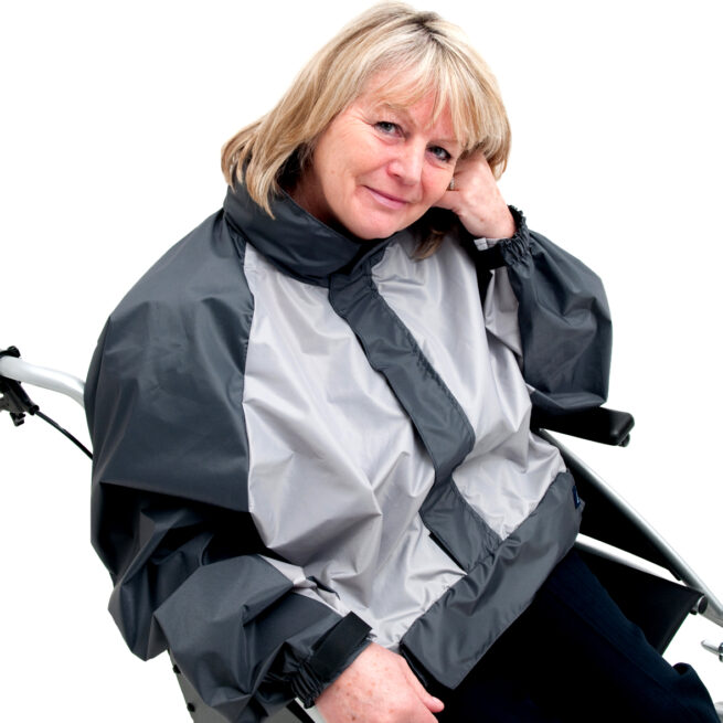 Woman wearing Black Grey wheelchair coat as a jacket