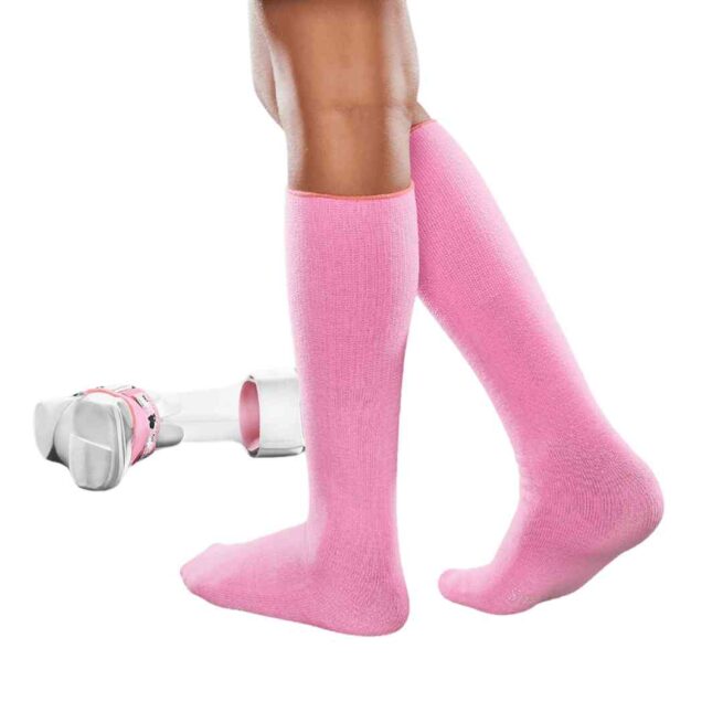 Child's legs wearing AFO seamless socks in pink