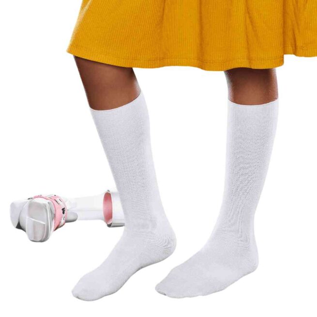 Child's legs wearing AFO seamless socks in white