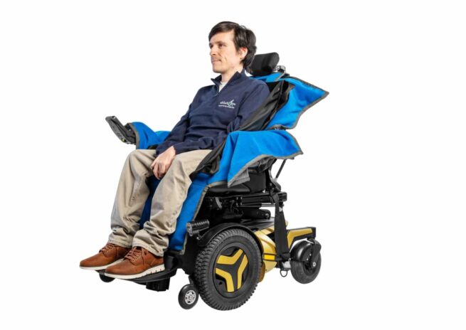 AbleDry_Wheelchair_Cover_Man_Sat_In_Wheelchair_on_blue_cover