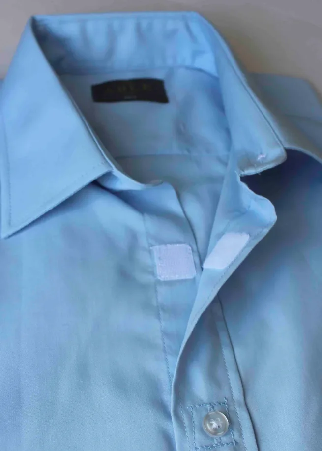 Close up of velcro fastenings on Hugo light blue shirt