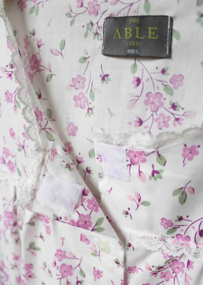 Close up of neckline with velcro fastenings on pink floral nightdress