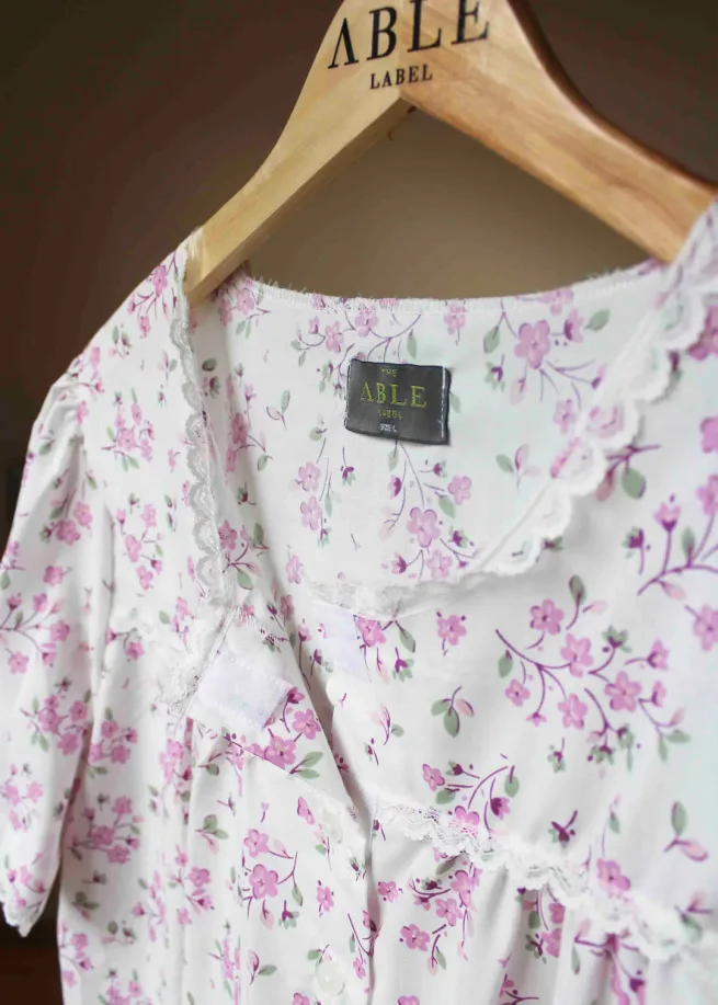 Close up of the short sleeve women's nightdress in pink floral with velcro fastenings