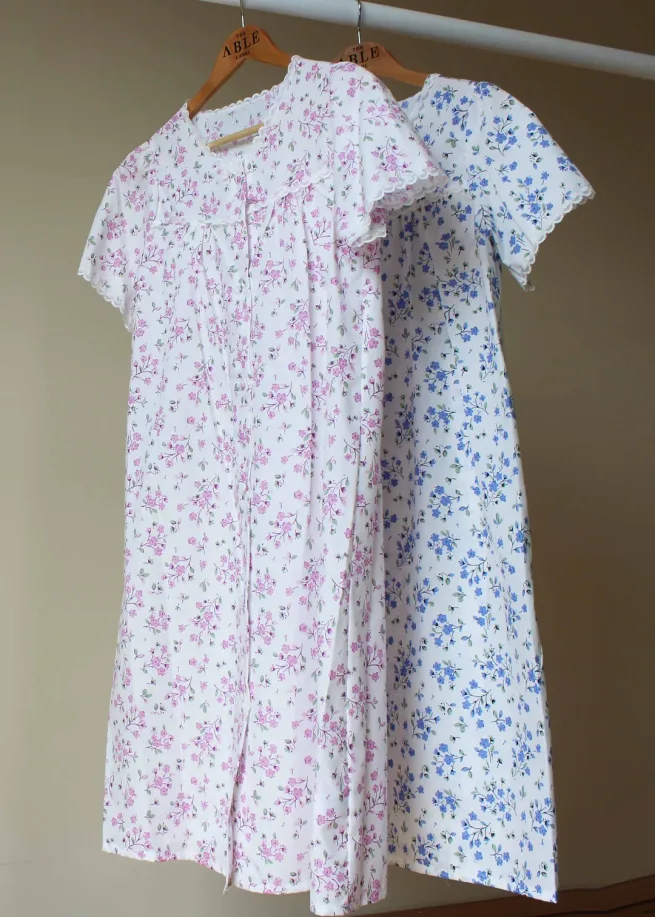 Image of both blue and pink floral jenny nightdress. Below the knee length with velcro fastenings