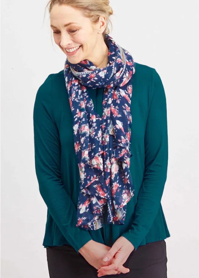 Women wearing The Able Label Steph top in teal, fastened with a blue print scarf