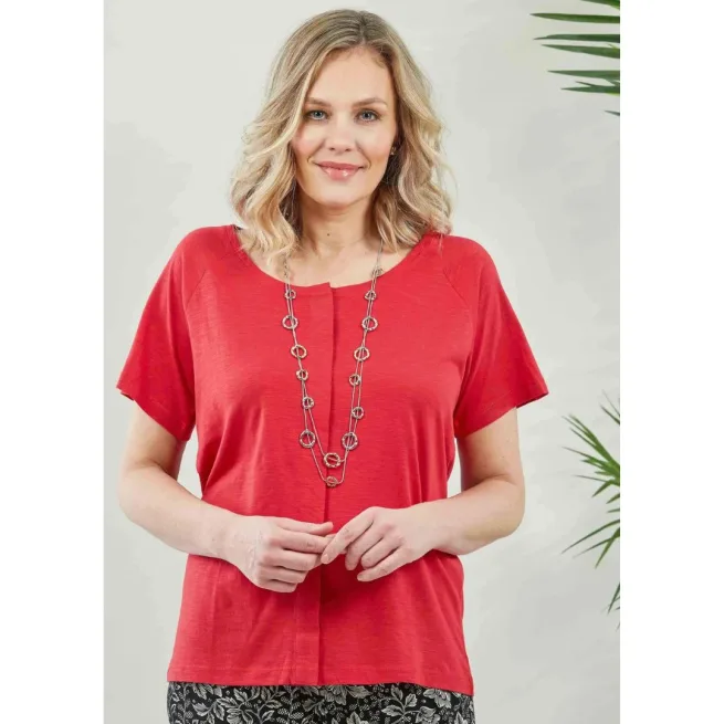 Woman wearing red tabatha short sleeve top with silver necklace