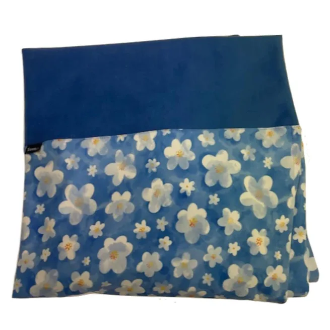 Image of folded wheelchair cover in blue flower pattern