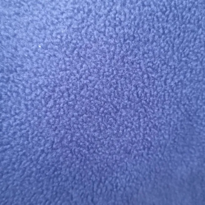 Close up image of denim fleece wheelchair cover material.